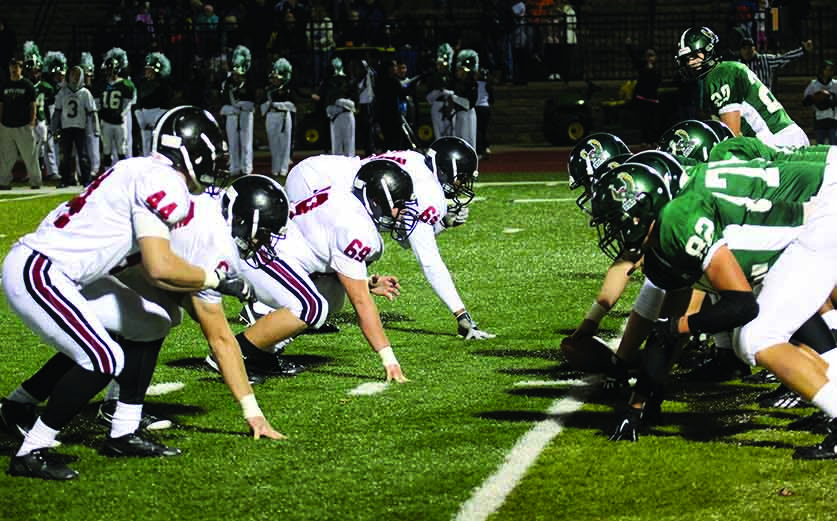 Lined up on the ball, football players on the LHS and FSHS teams get ready for a play on Nov. 1. FSHS won 28-10.