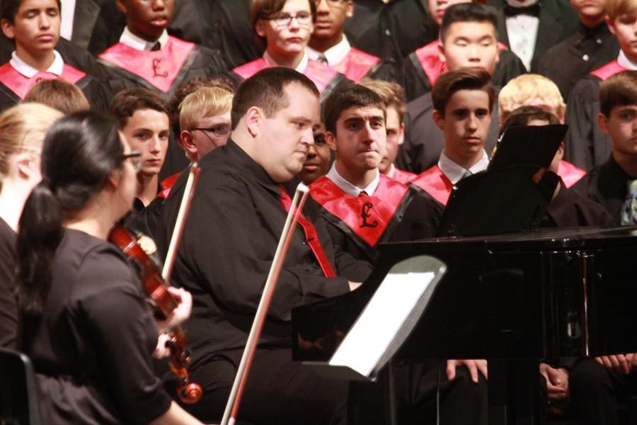 Accompanying a choral piece, Randall Frye assists in his first major concert at LHS.