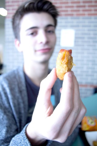 Tuesdays are chicken strip days for junior Nathaniel Hoopes in the Free State lunchroom. Photo by Nick Popiel, The Free Press