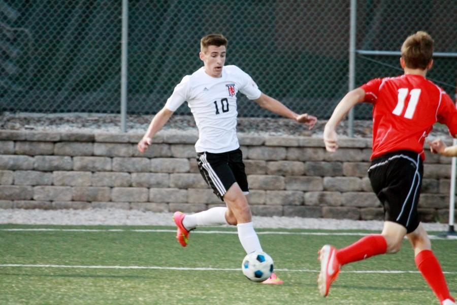 Setting up a shot, senior Jakob Burdett led the varsity soccer team in number of goals socred and earned a spot on the All-Sunflower Leauge team.