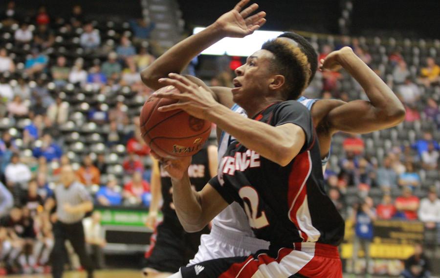 John Barbee pushes to the basket during the first half of the state championship game.