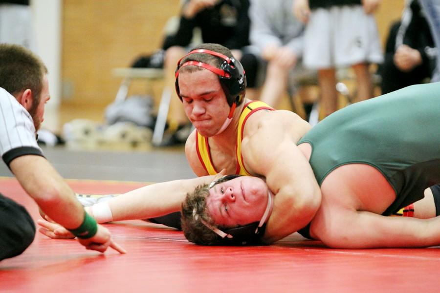Reece Wright-Conklin pins a Free State High School opponent during a wrestling meet in 2012.