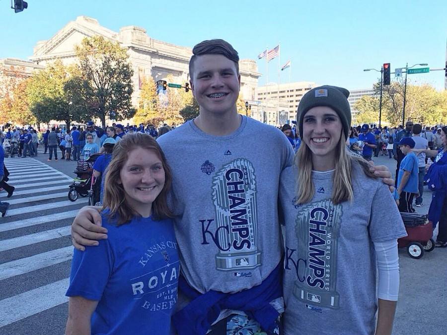Juniors Renae McNemee, Noah Kucza and Skylar Drum attended the Royals parade in downtown Kansas City on Tuesday, Nov. 3. “The never-ending sea of blue was inspiring and awesome to see people of all shapes and sizes come together because of a team,” Kucza said. Photo courtesy of Noah Kuzca 
