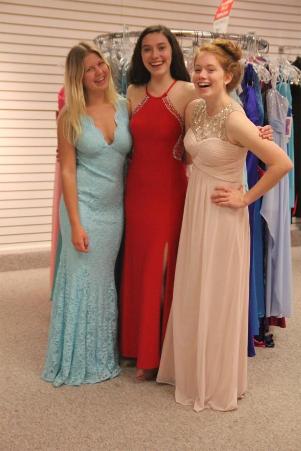 Members of the Budget staff try on prom dresses downtown at Weavers to show potential outfits. Prom is next Saturday, May 7. 