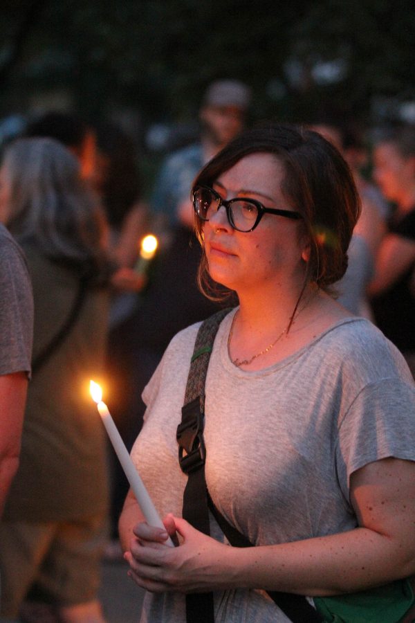 Sympathizing — English and theater teacher Jamie Johnson shows support at the candlelit. Photo by Ian Jones
