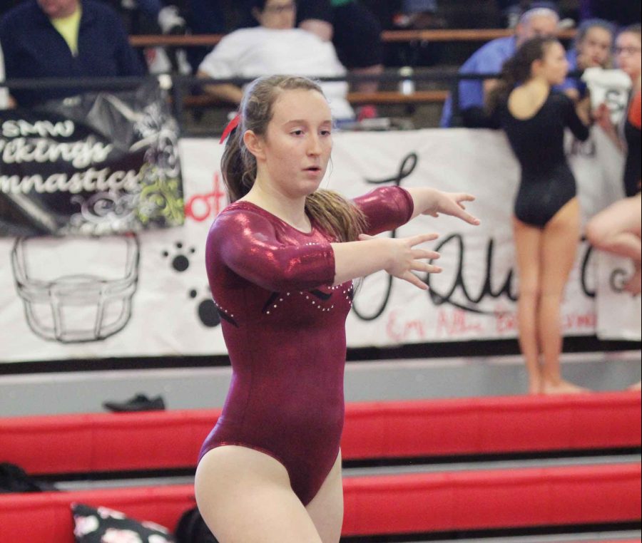 Pirouetting — Junior Eliana Seidner does her routine on the balance beam at the Sunflower League Meet at LHS on Oct. 8. Seidner finished the event in 17th place and tied for 14th in vault. The team took fifth. 