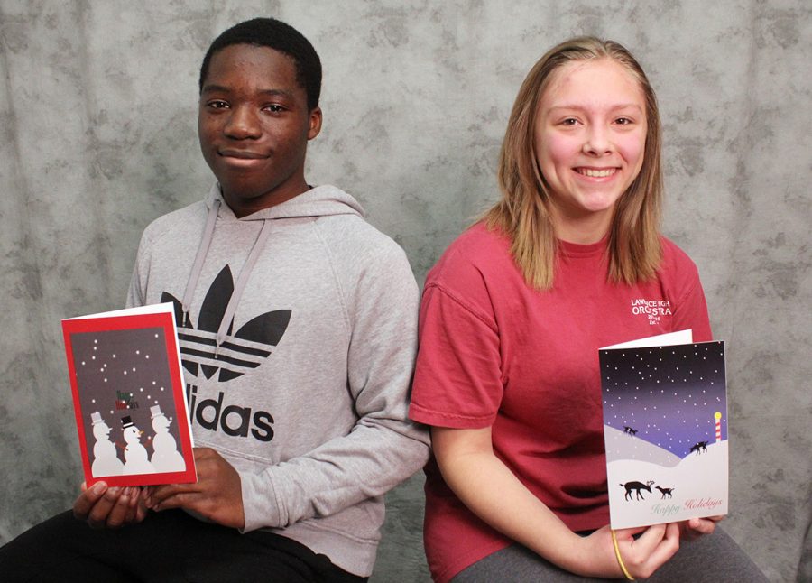 David Obadare and Jaylynn Hicks pose with the cards they designed for the Lawrence Schools Foundation.