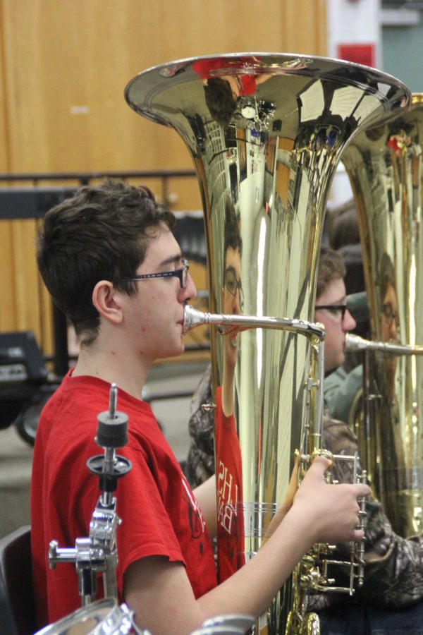 Practicing — Concert tuba player, Noah Stussie, plays in preparation for the Regional Music Competition.