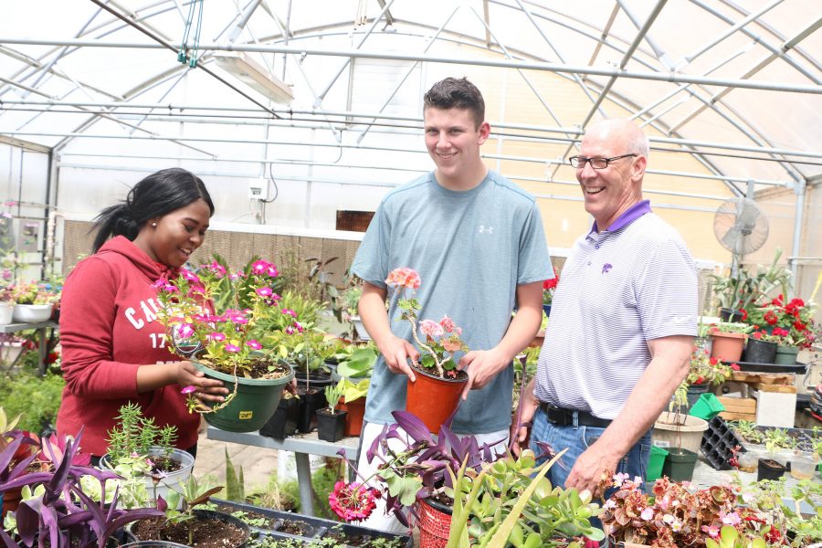 Animal and Plant Science teacher Mark Rickabaugh teaches students in the greenhouse. He is retiring this year.