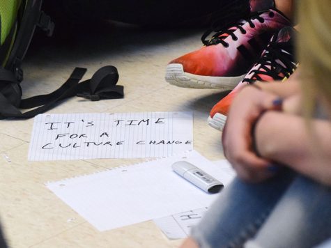 Students created hand-written sings to hold during the sit-in on Monday at Lawrence High School