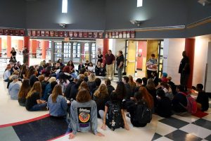 Students begin gathering for a sit-in during second hour on Monday in the rotunda. The crowd grew as the day went on.