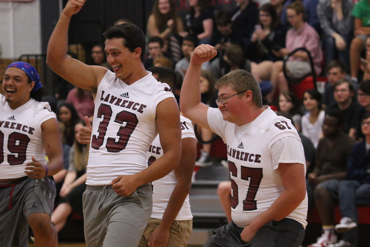 Senior Hunter Krom and other members of the LHS football team dance at the fall sports assembly earlier this month. The Lions play their first home game on Sept. 15 after starting the season with two wins on the road.