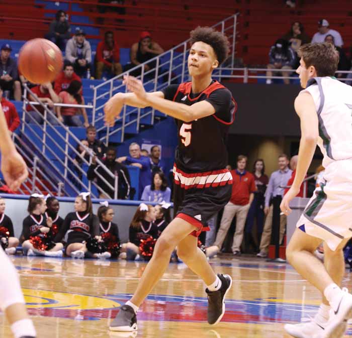 striving for greatness — Freshman Zeke Mayo shows off his ability at the City Showdown on Dec. 15 at Allen Fieldhouse. “Being vocal on the court, that’s really helped me,” Mayo said. 