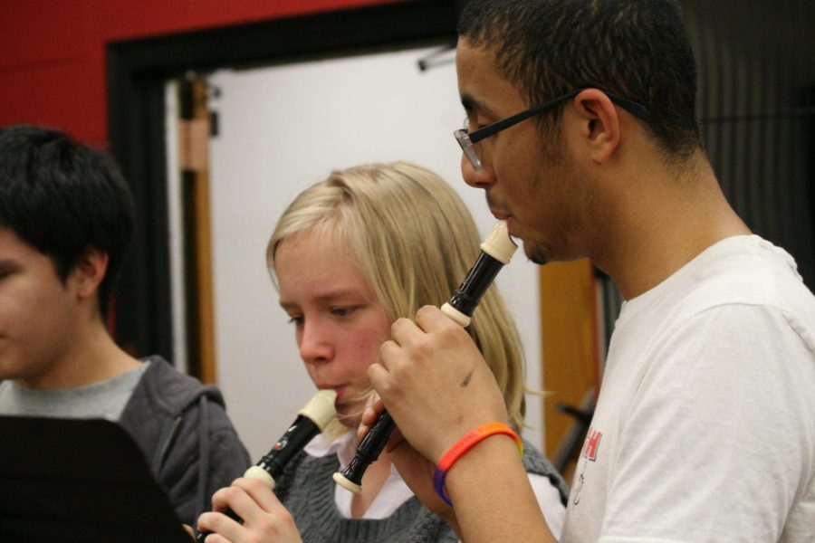 blown Away — Harmonizing, senior Mark Garcia and sophomore Rose Hicks play their recorders as they participate in the ensemble Going for Baroque. The ensemble practiced and played the tune ‘Lux Aeterna.’ “I thought it would be fun and ironic to play an instrument that most people find annoying,” Hicks said. “I enjoyed the people in it because they were OK with the fact that I haven’t played since fifth grade, and they let me take time to relearn and remember how to play the recorder.”