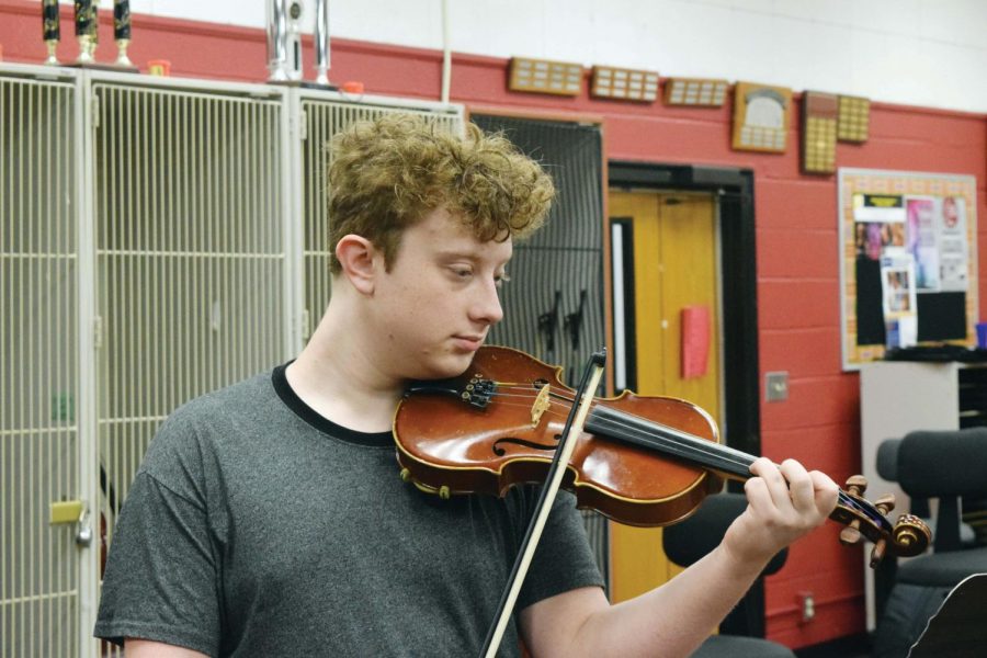 Fiddling around, senior Jack Foster has taken on the responsibility of hosting Fiddle Club after school in the orchestra room. Foster plans to expand on activities the club does. “Orchestra class is a lot more structured” Foster said. “Fiddle Club is a lot more of improvisation and a lot more casual and simple music.”