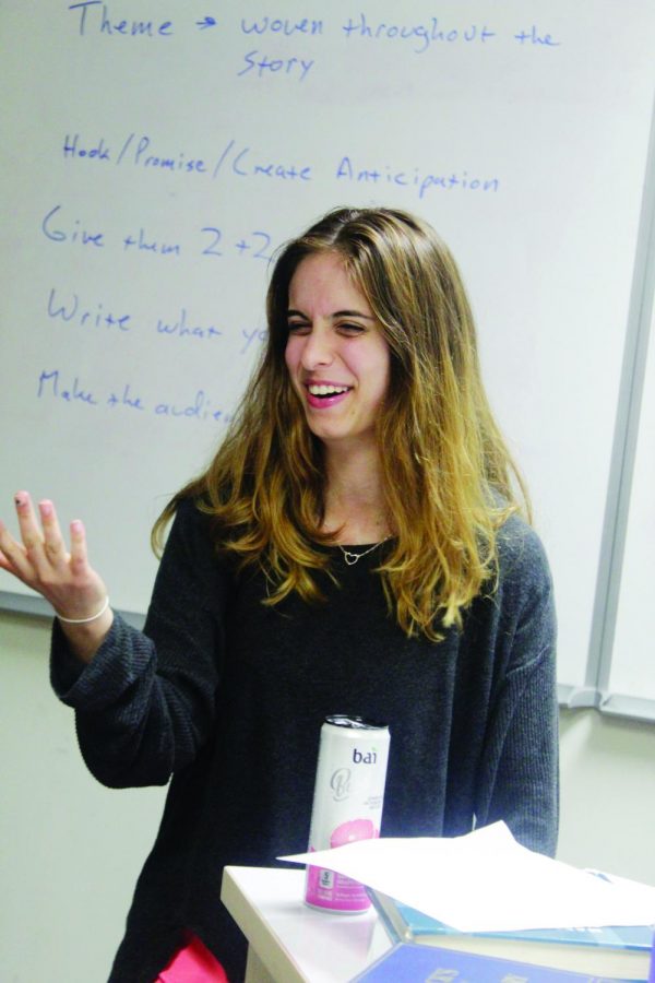Senior Vera Petrovic has fun while working hard at a debate work night on Oct. 3. Like many students in debate, Petrovic has a personal connection to the topic of immigration. Her parents are from Serbia.