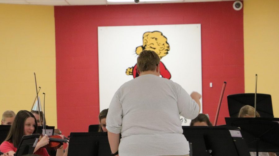 Orchestra teacher Mariah Barnett conducts for the orchestra at their Oktoberfest on October 7.