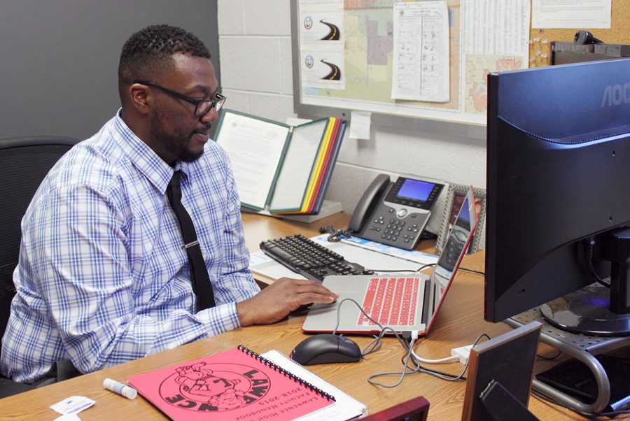 Working in his new office, Quentin Rials adjusts to his first day as a Lawrence High Assistant Principal, on November 20th. Rials is assuming the duties of former Assistant Principal Mike Norris.