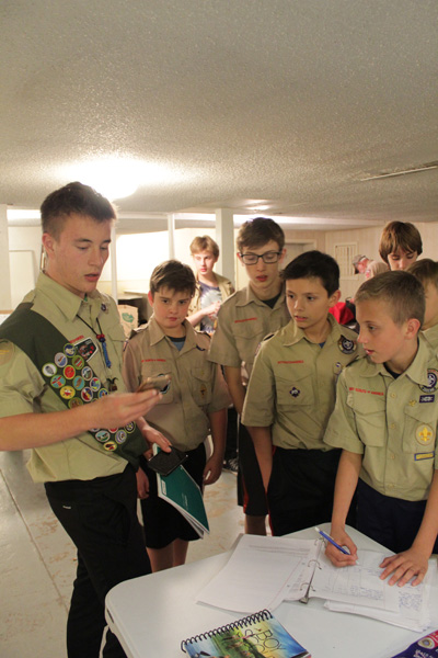Senior Alexander Arnone, a member of Troop 61, presents his Eagle Scout project to younger scouts. Students working on their Eagle Scout have to delegate work to younger scouts and others who help them complete their projects. “To see my younger scouts take part in a project I planned for more than year…was pretty rewarding,” Arnone said. “[It’s] why I chose the project and make them understand why they’re helping out.