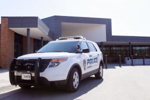 A Lawrence Police Department SUV is parked outside Lawrence High School on the afternoon of Tuesday, Feb. 12. Earlier in the day, a gun was removed from a student at school. It was the second such incident in less than a week.