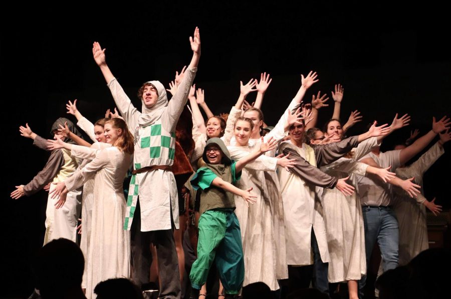 Arms outstretched, junior Noah Stussie stands front and center during the finale of his song You Wont Succeed on Broadway if You Dont Have Any Jews, during the winter musical, Monty Pythons Spamalot, on Jan. 25.