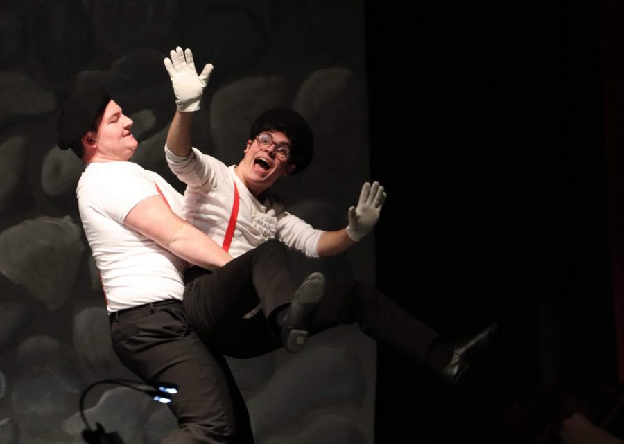 Expressional, senior Jerod Cote gets carried off stage by senior Davis Reed during the winter musical, Spamalot. Cote and Reed play French mimes during the Trojan Bunny scene along with Napoleon Bonaparte and various French artists.