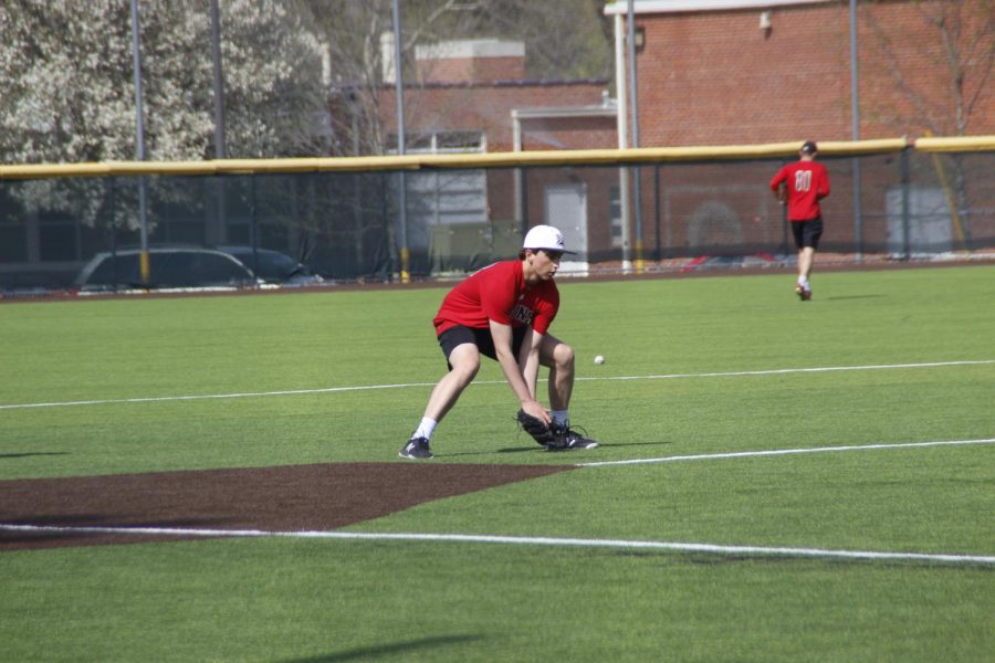Senor pitcher Jackson Hewins fields a ground ball in practice. Hewins, after tearing his UCL, recovered from surgery in time to star in his senior season.
