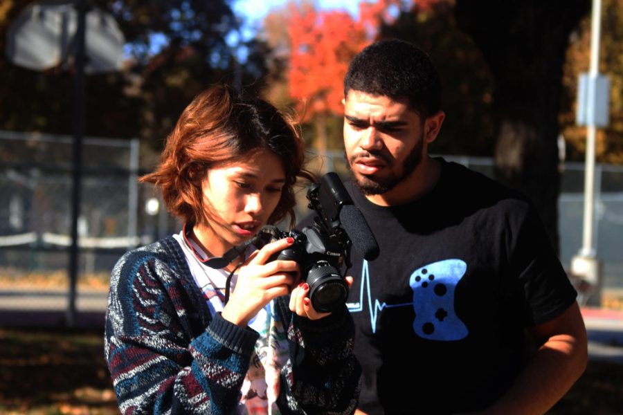 Film students Mia Robinson (left) and Kindred Curry (right) review a shot.
