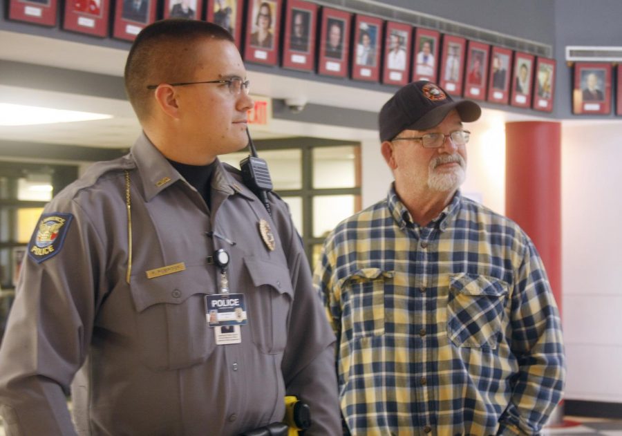 SRO Ryan Robinson stands in the rotunda during the lunch on Nov. 6 next to Joe Schaumburg. Robinson is an LHS graduate.