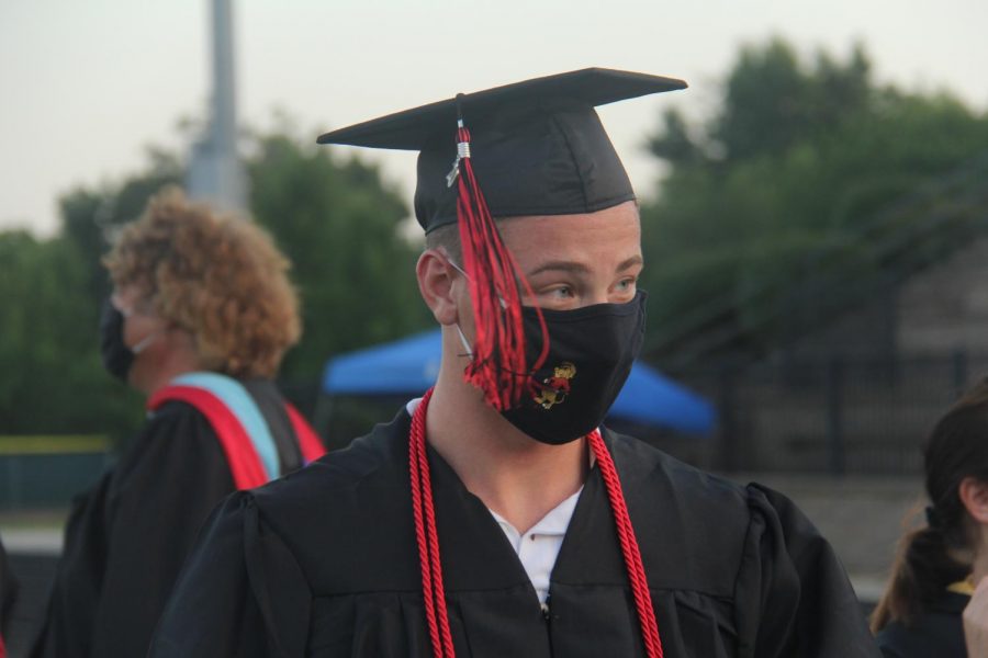After a nearly two-month delay, Lawrence High seniors graduated on Saturday night. Participants were told to wear masks and stay distant as COVID-19 cases have been rising rapidly in Douglas County and the state overall. The stands remained clear. Instead graduates and their guests walked through the event at tiered times.