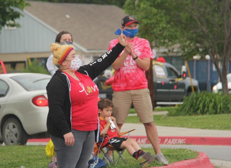English teacher Abby Hoffman waves to students from a distance during the Celebrate the Date in late May 2020. 