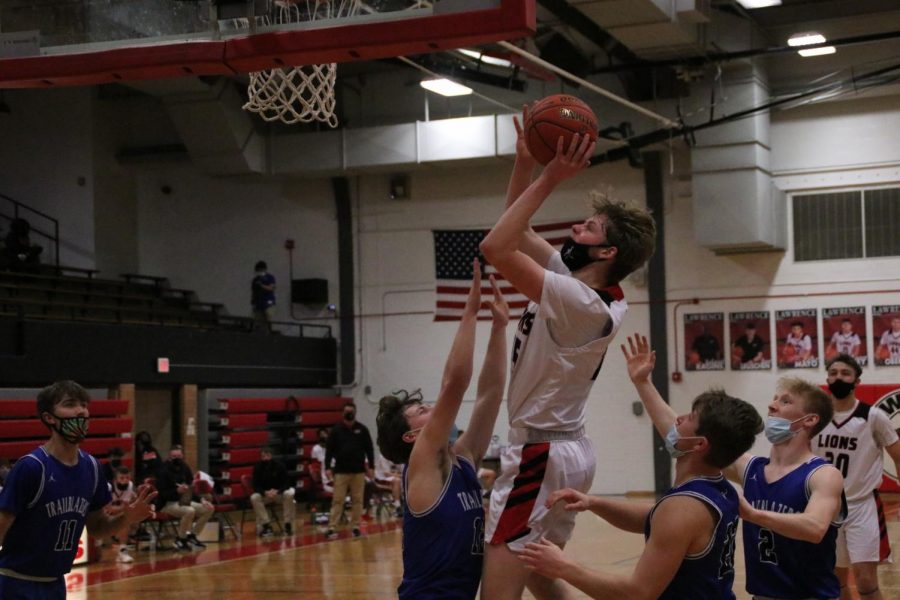 Junior Pearse Long goes for a layup during a home basketball game against Gardner Edgerton on Thursday Jan. 28th.