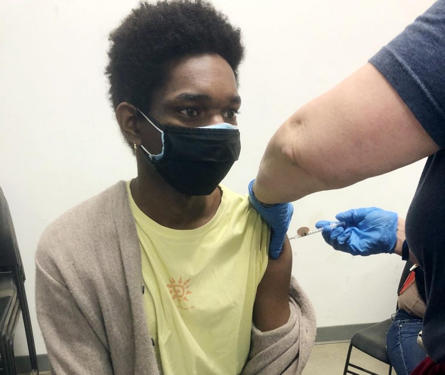 Senior Donnavan Dillon receives the second vaccine dose to protect against COVID-19 on March 26. Dillon received the first shot after volunteering a county vaccination clinic at the Douglas County Fairgrounds earlier in the month.