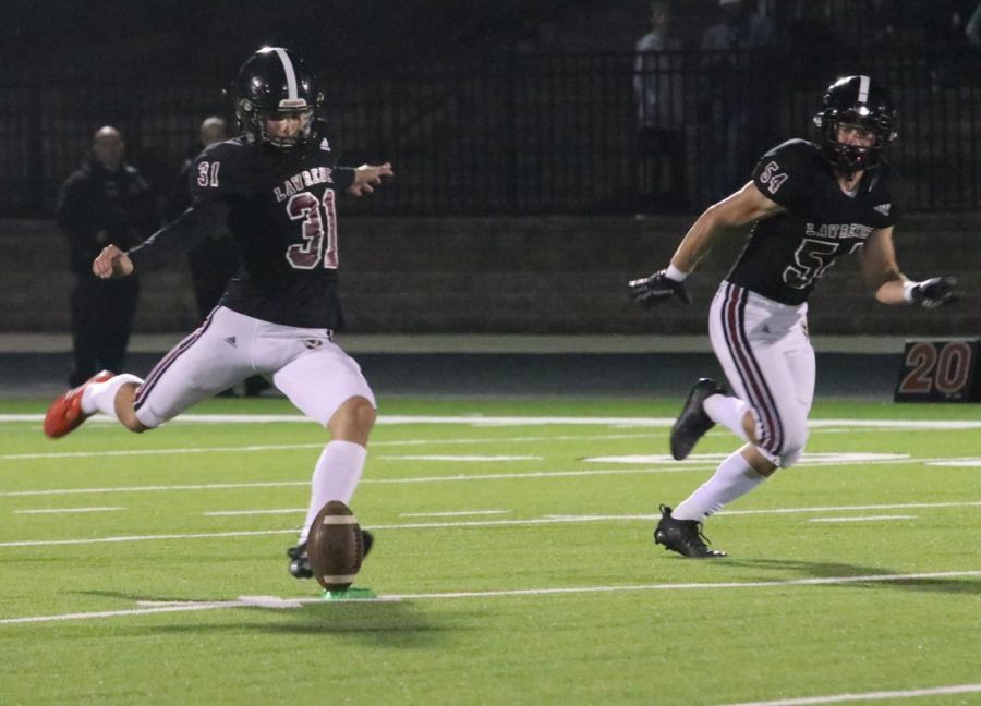 Senior Grant Glasgow kicks during the Oct. 22 win over Free State. 
