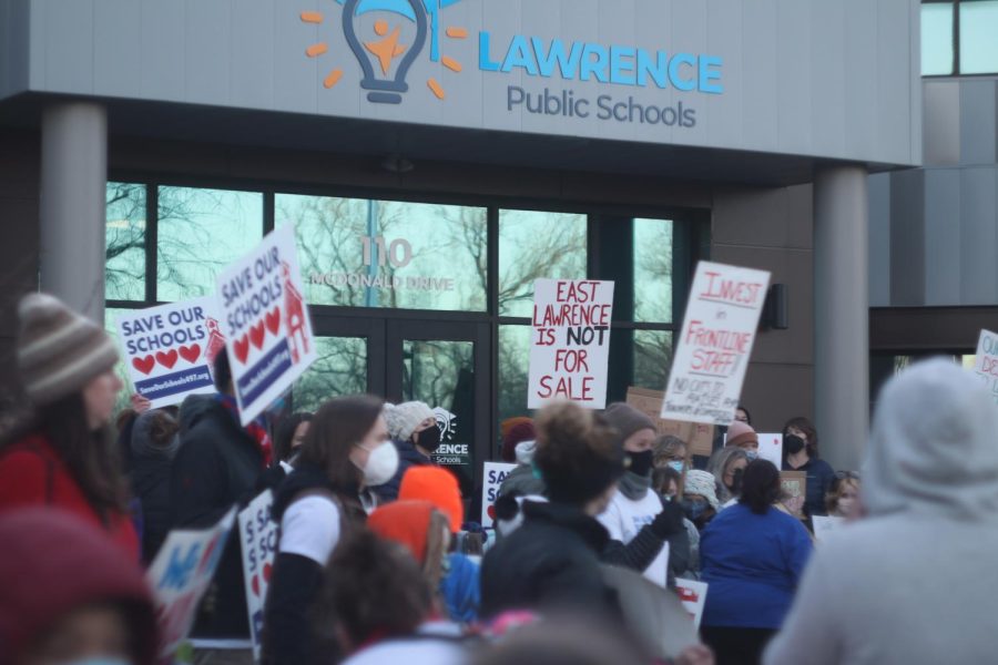 Community members protest against proposed school closures
