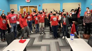 PAL-CWA union members take a photo at a bargaining meeting on Feb. 21, 2022.