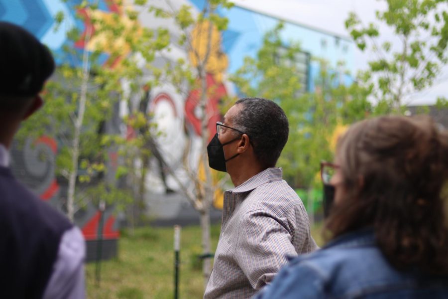 John Spearman Jr. gazes at a section of the LHS mural which depicts the protests he was involved in.