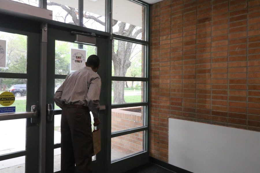 John Spearman Jr. looks out the former front doors of LHS where his brother, Michael, helped lead a protest for Black student rights. 