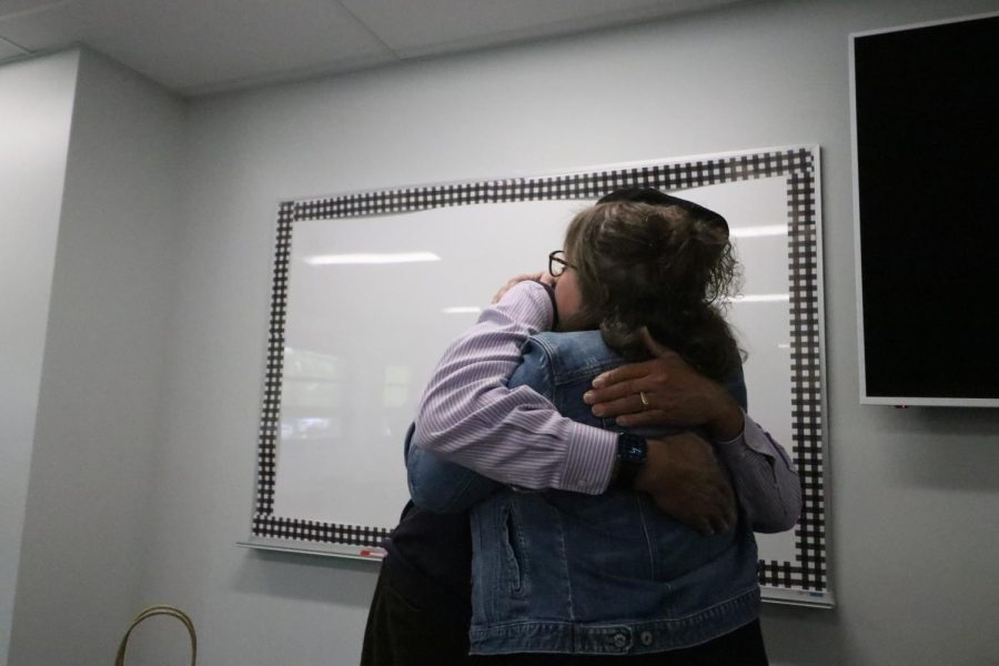 Michael Spearman and teacher Valerie Schrag share a heartfelt moment.  