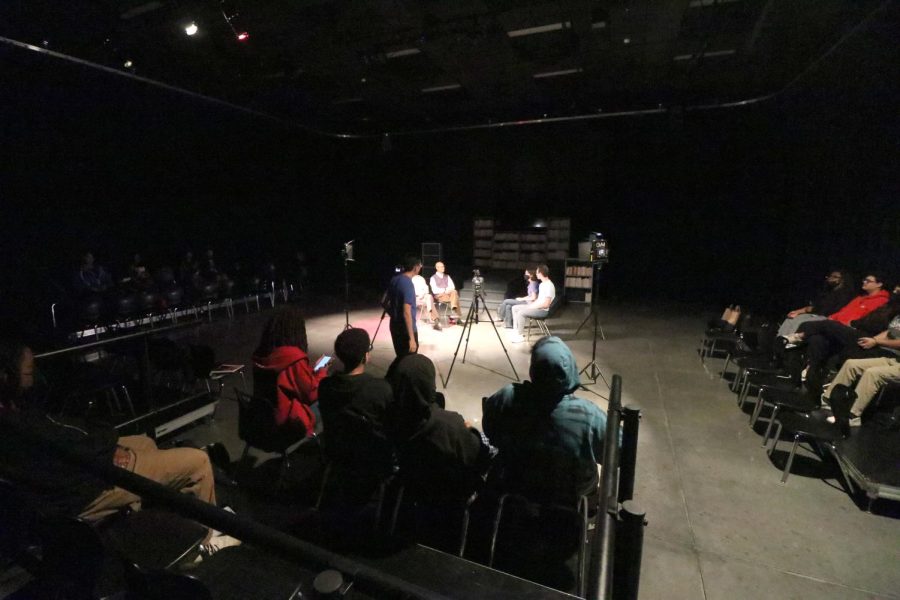 In+the+blackbox+theatre%2C+LHS+students+sit+and+listen+to+a+discussion+with+the+Spearman+brothers.+