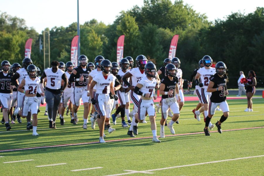 The Lawrence High football team takes the field at the 2022 Fall Sports Jamboree.