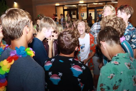 A group of juniors and seniors dances at the Lions Leap Dance. One of the first school events of the year, students came to show school spirit with the tropical theme. As senior Carson Schraad said, I think school spirit is just attending everything you can and just showing up in total support for anything whenever you can.