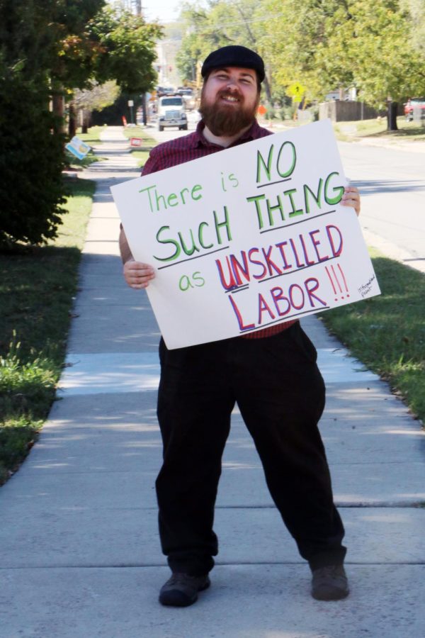 Workers protested outside of LHS on Thursday afternoon as they push for higher pay and improved working conditions.