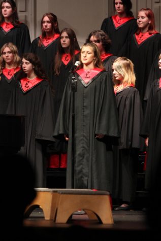 Sophomore Cadence Scholz, a member of Bellissima choir, sings a solo at the Fall choir concert.