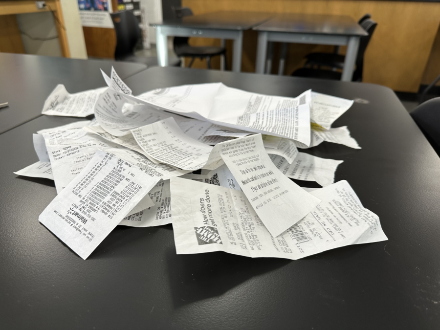 A pile of receipts totaling over 750 dollars sits on one of Marci Leuschens classroom desks.
