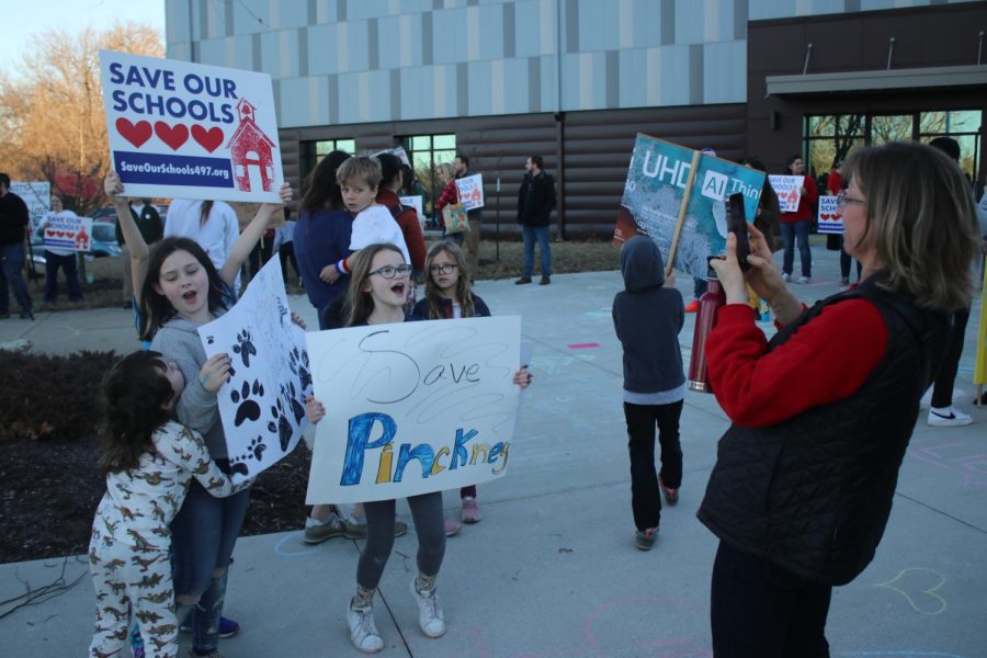 Students, staff and families protest with Save Our Schools before the school board meeting. 