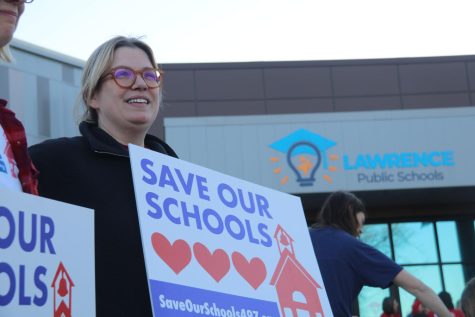  Students, staff and families protest with Save Our Schools before the school board meeting. 