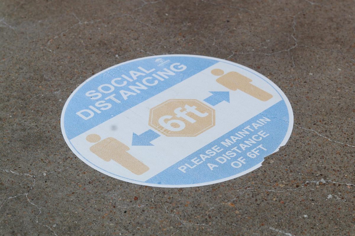 One of the few remaining social distance signs on the floor throughout the building. 