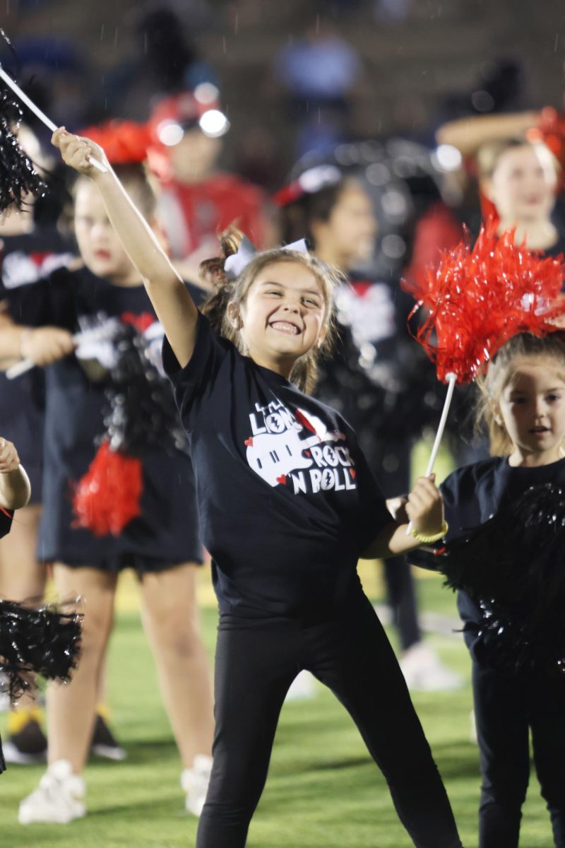 Little Lions take the field for halftime of the Sept. 15 football game against Shawnee Mission East. Participants danced while the band played its halftime show.