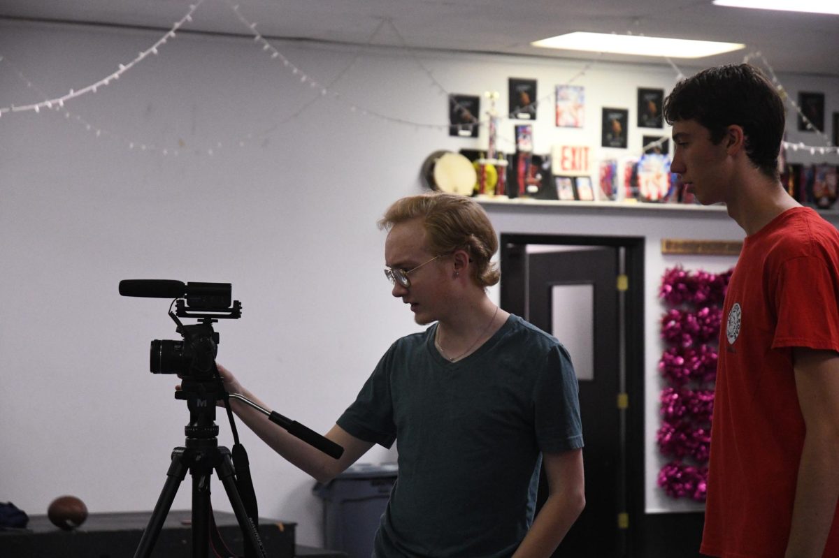 Senior Oliver Reed films the Homecoming video that Room 308 produced in September. 
